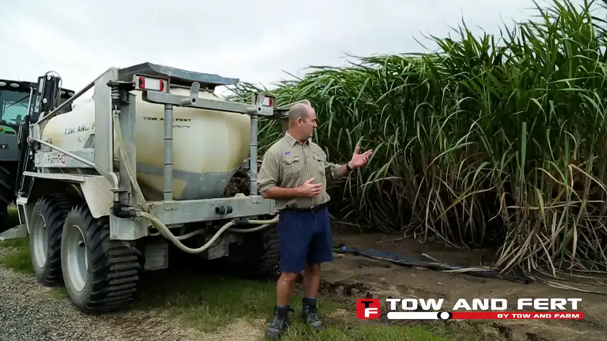 Paul Rogers standing beside his Tow and Fert unit at his sugar cane property, Proserpine, Queensland.
